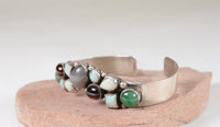 Contemporary Navajo hand made Bracelet with multiple stone settings