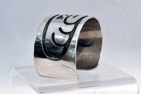 An Early Hopi Sterling Silver Overlay Bracelet, Sikyátki Bird- Dance Wand motif