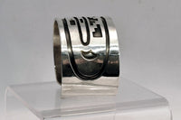 An Early Hopi Sterling Silver Overlay Bracelet, Sikyátki Bird- Dance Wand motif