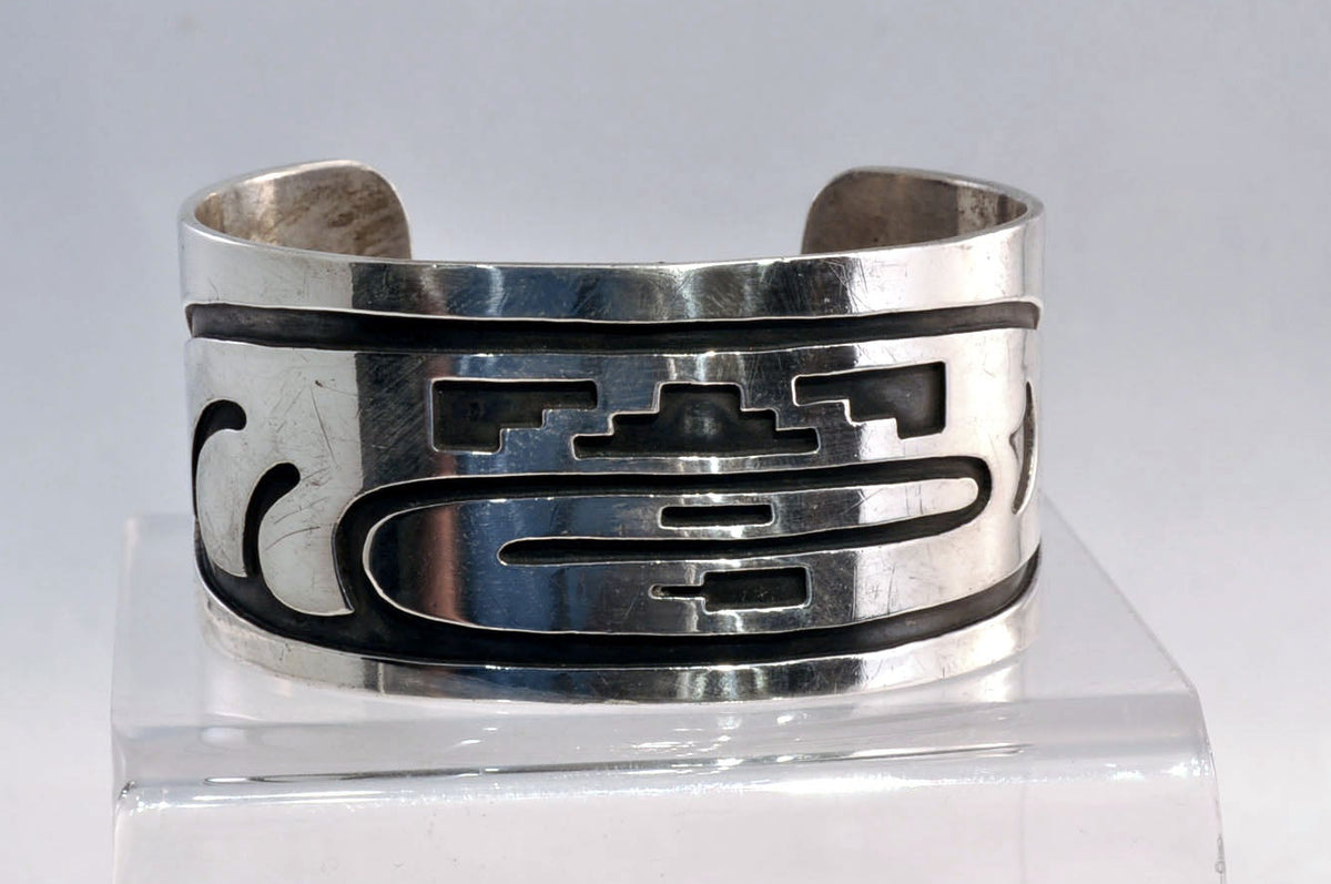 An Early Hopi Sterling Silver Overlay Bracelet, Sikyátki Bird- Dance Wand motif