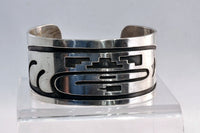 An Early Hopi Sterling Silver Overlay Bracelet, Sikyátki Bird- Dance Wand motif
