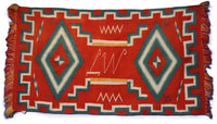 Navajo Germantown runner with initials "LW" in weaving