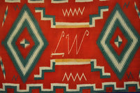 Navajo Germantown runner with initials "LW" in weaving