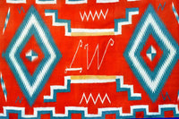 Navajo Germantown runner with initials "LW" in weaving