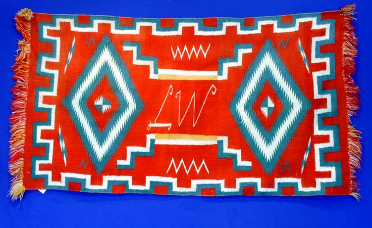 Navajo Germantown runner with initials "LW" in weaving