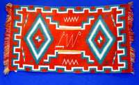 Navajo Germantown runner with initials "LW" in weaving