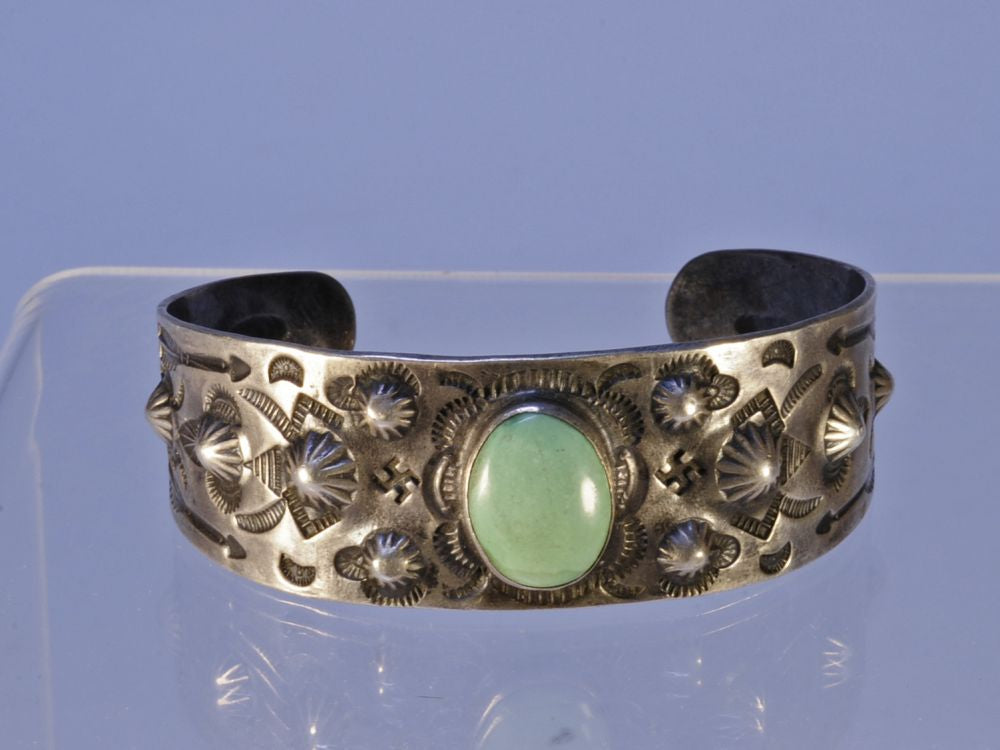Navajo bracelet with repousse stamp work; Sterling Silver and Turquoise