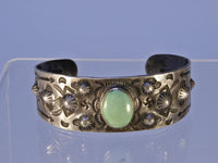 Navajo bracelet with repousse stamp work; Sterling Silver and Turquoise