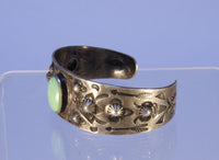 Navajo bracelet with repousse stamp work; Sterling Silver and Turquoise