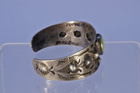 Navajo bracelet with repousse stamp work; Sterling Silver and Turquoise