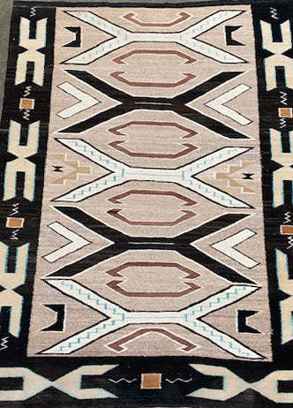 An Early Navajo Rug, Teec Nos Pos with a Reduced End