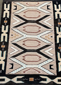 An Early Navajo Rug, Teec Nos Pos with a Reduced End