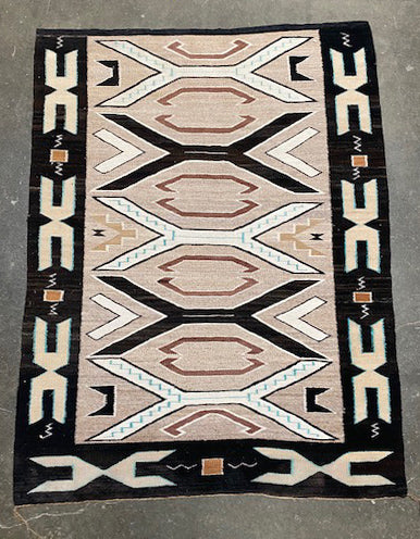 An Early Navajo Rug, Teec Nos Pos with a Reduced End