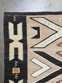 An Early Navajo Rug, Teec Nos Pos with a Reduced End