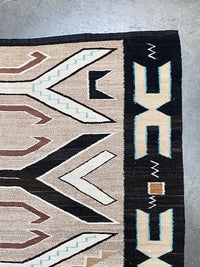 An Early Navajo Rug, Teec Nos Pos with a Reduced End