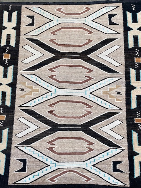 An Early Navajo Rug, Teec Nos Pos with a Reduced End