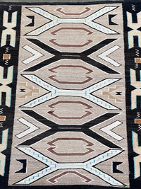 An Early Navajo Rug, Teec Nos Pos with a Reduced End