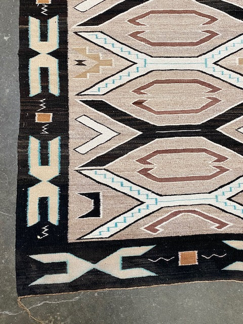 An Early Navajo Rug, Teec Nos Pos with a Reduced End