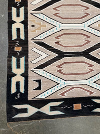 An Early Navajo Rug, Teec Nos Pos with a Reduced End