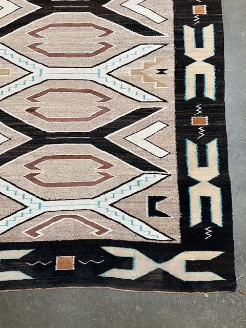 An Early Navajo Rug, Teec Nos Pos with a Reduced End