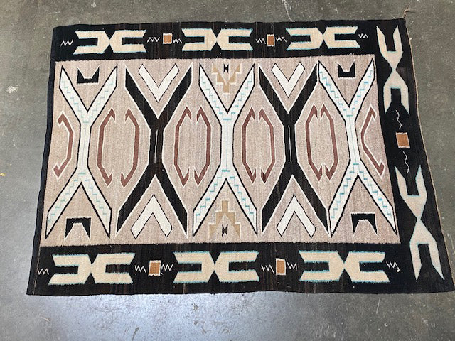 An Early Navajo Rug, Teec Nos Pos with a Reduced End