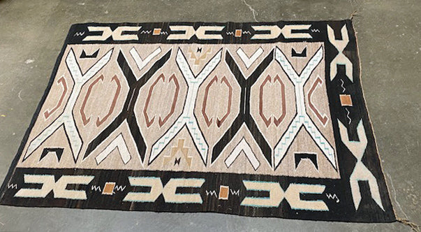An Early Navajo Rug, Teec Nos Pos with a Reduced End
