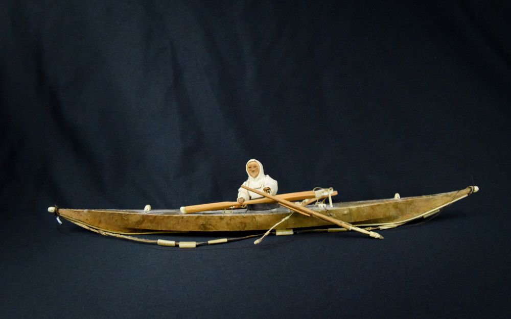 Antique Greenland Inuit Kayak with figure and implements