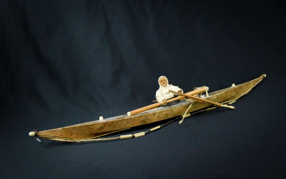 Antique Greenland Inuit Kayak with figure and implements