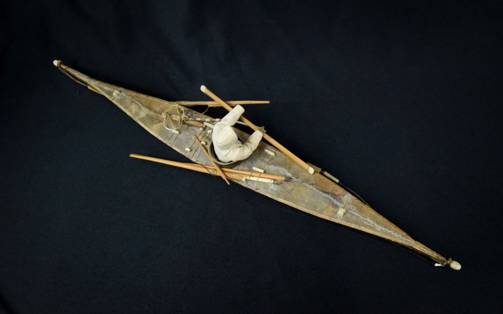 Antique Greenland Inuit Kayak with figure and implements