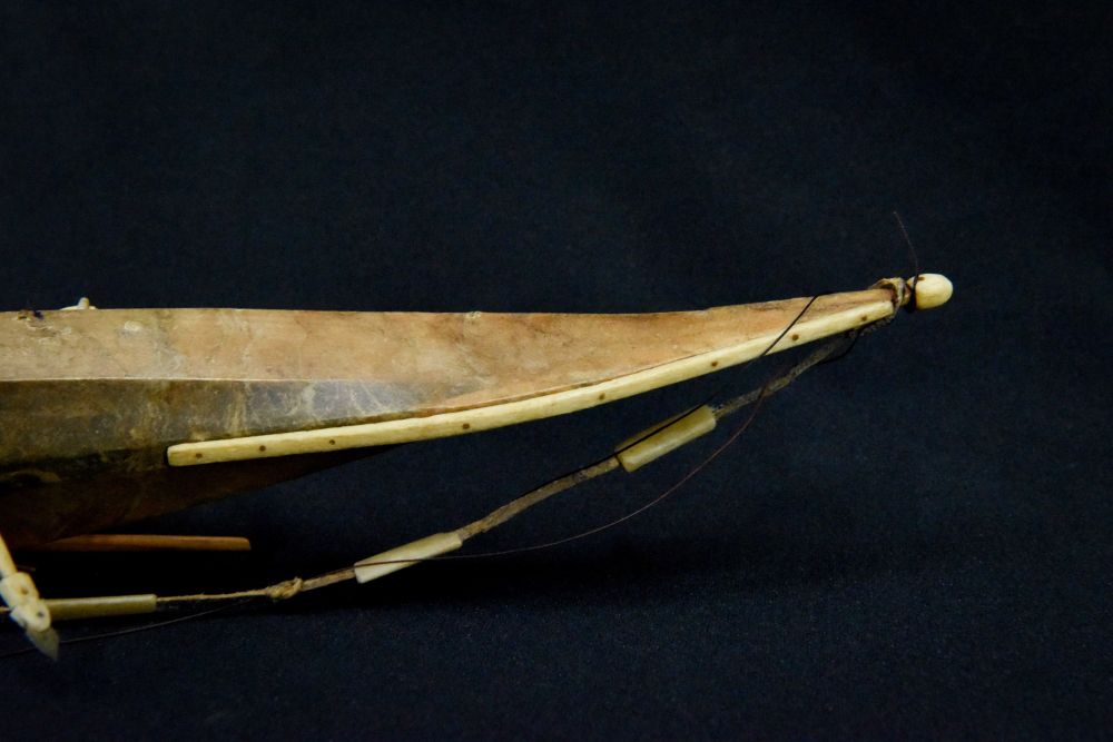 Antique Greenland Inuit Kayak with figure and implements