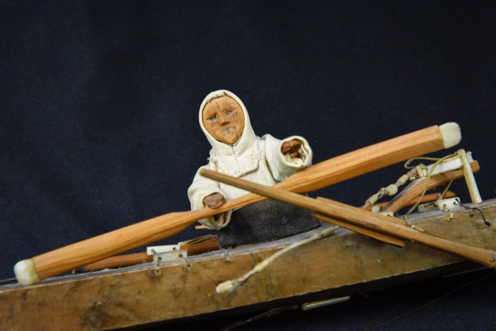 Antique Greenland Inuit Kayak with figure and implements