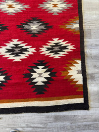 An Early Navajo Rug, Ganado Red