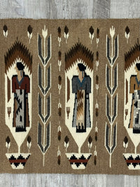Navajo Pictorial Rug; Weavers Holding Rugs