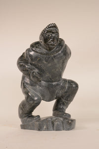 Large Inuit Steatite Soapstone Man with Hiding Seal Sculpture  Peter Juanista