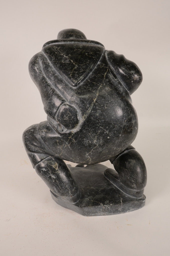 Large Inuit Steatite Soapstone Man with Hiding Seal Sculpture  Peter Juanista