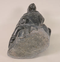 Large Inuit Steatite Soapstone Man with Hiding Seal Sculpture  Peter Juanista