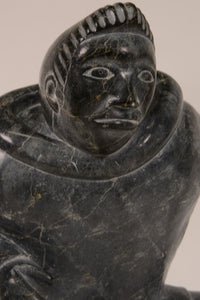 Large Inuit Steatite Soapstone Man with Hiding Seal Sculpture  Peter Juanista