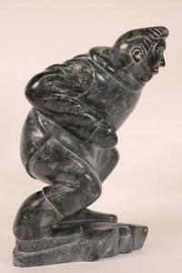 Large Inuit Steatite Soapstone Man with Hiding Seal Sculpture  Peter Juanista