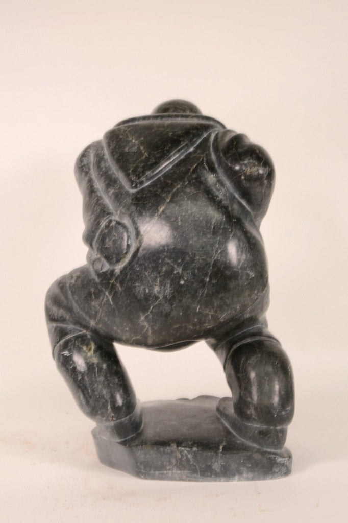 Large Inuit Steatite Soapstone Man with Hiding Seal Sculpture  Peter Juanista