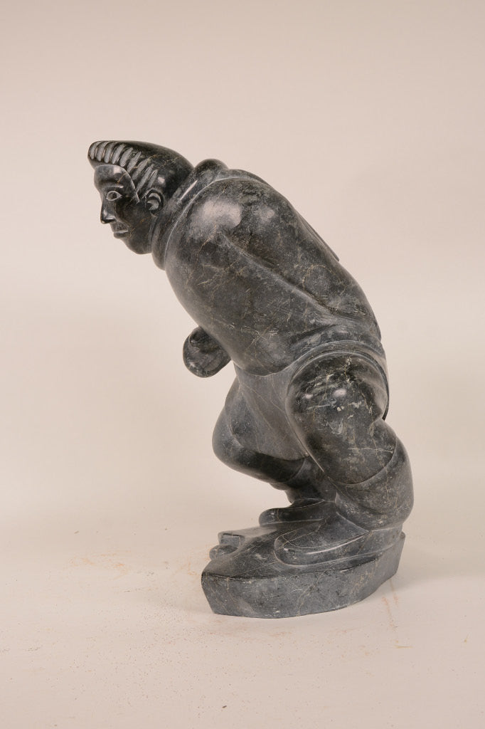 Large Inuit Steatite Soapstone Man with Hiding Seal Sculpture  Peter Juanista
