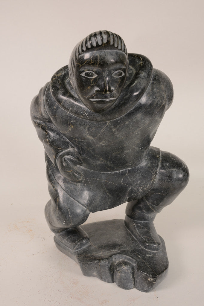 Large Inuit Steatite Soapstone Man with Hiding Seal Sculpture  Peter Juanista
