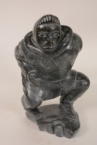 Large Inuit Steatite Soapstone Man with Hiding Seal Sculpture  Peter Juanista