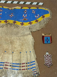 Antique Beaded Hide Sioux Girls Dress in Frame with other small beaded items