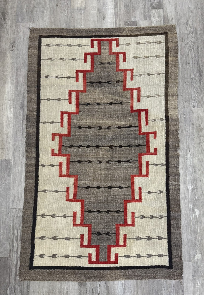 An Early Navajo Klagatoh Rug with Corn Plant Motif Banding