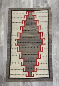 An Early Navajo Klagatoh Rug with Corn Plant Motif Banding