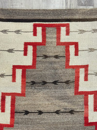 An Early Navajo Klagatoh Rug with Corn Plant Motif Banding
