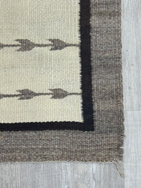An Early Navajo Klagatoh Rug with Corn Plant Motif Banding