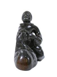 Eskimo Man and Seal Sculpture