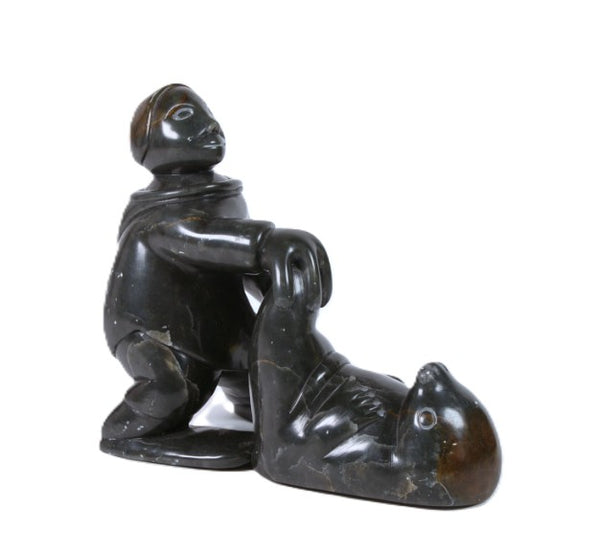 Eskimo Man and Seal Sculpture