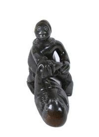 Eskimo Man and Seal Sculpture